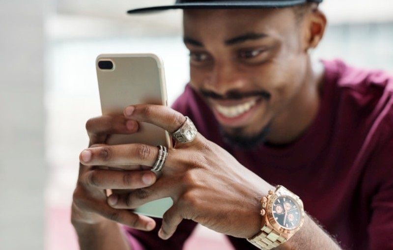 African man using mobile phone