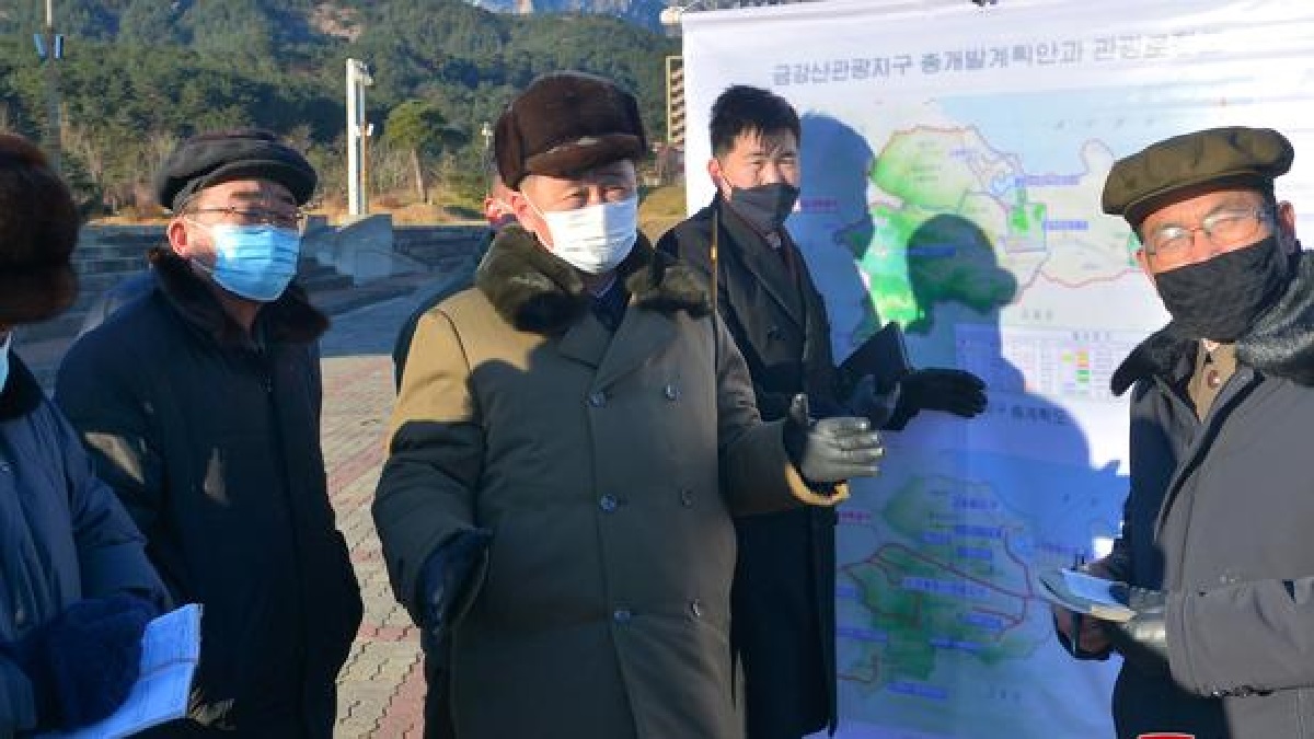 North Korea's Premier Kim Tok Hun wears a face mask while visiting the Mount Kumgang tourist area in North Korea