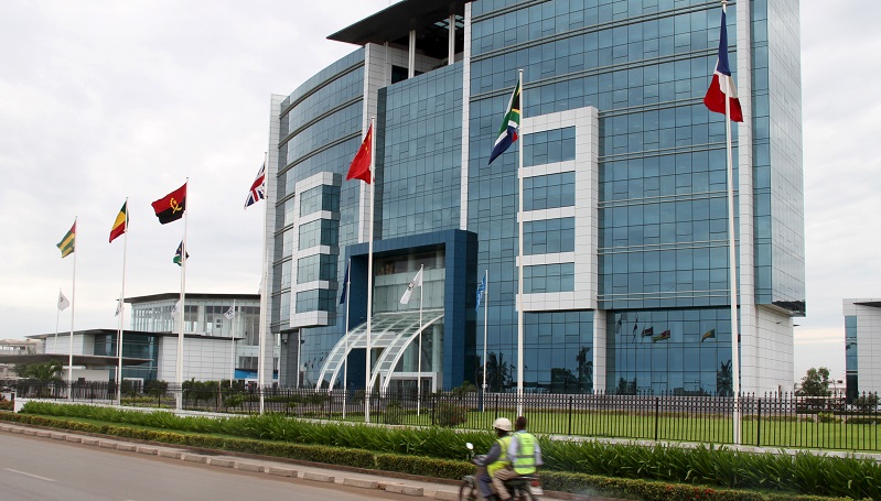 Motorcyclist rides past the Ecobank headquarters in Lome