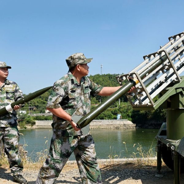 Militia members load an equipment for cloud-seeding operations as part of the drought relief measures amid a heatwave warning in Dongkou county of Shaoyang, Hunan province, China August 17, 2022. China Daily via REUTERS  ATTENTION EDITORS - THIS IMAGE WAS PROVIDED BY A THIRD PARTY. CHINA OUT.